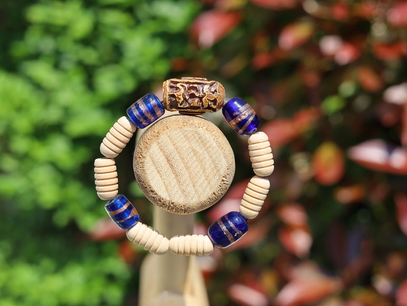 Wooden Turned  beads with Glass bead cobalt blue tubes. And reat authentic look & feel - carved decoration of a Lotus flower