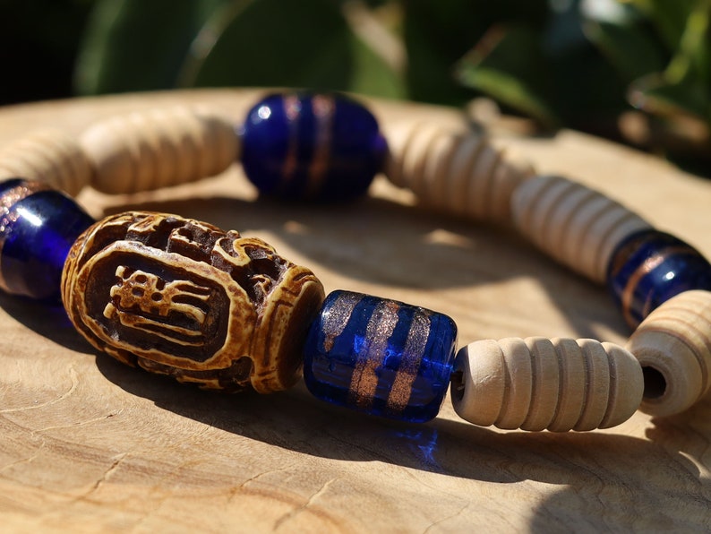 Wooden Turned  beads with Glass bead cobalt blue tubes. And reat authentic look & feel - carved decoration of a Lotus flower