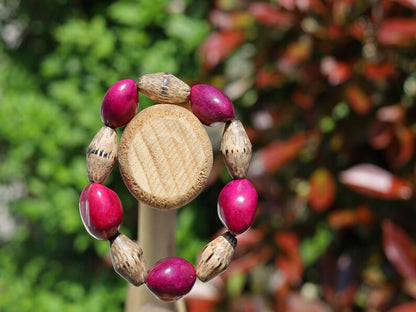 Beautiful large Lumbang seed bordeaux fuchsia Lumbang seed with Palmwood bicone brown beads.