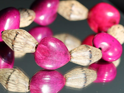 Beautiful large Lumbang seed bordeaux fuchsia Lumbang seed with Palmwood bicone brown beads.