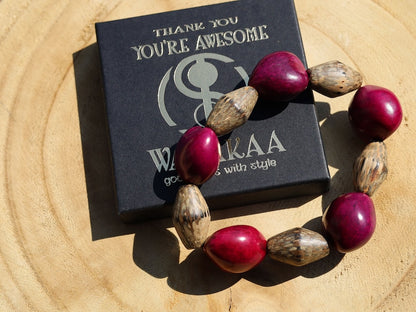 Beautiful large Lumbang seed bordeaux fuchsia Lumbang seed with Palmwood bicone brown beads.