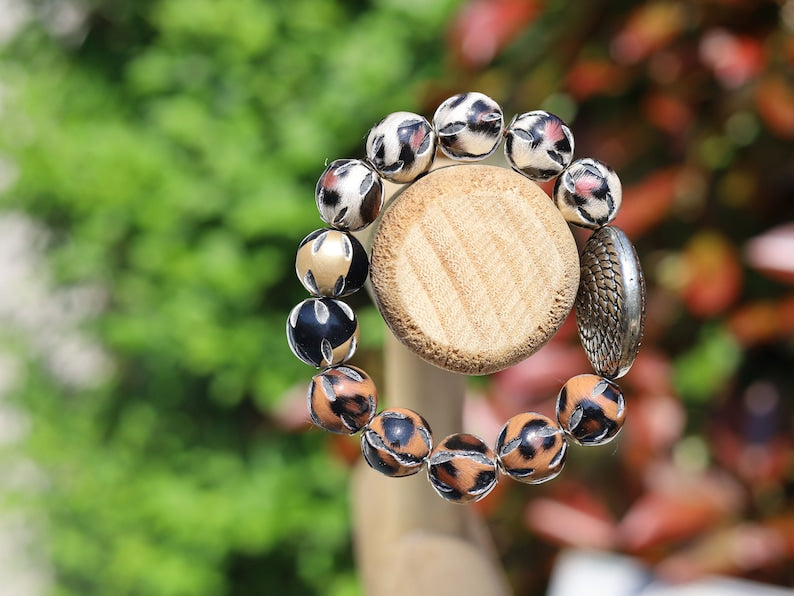 Unique Silver color metal look coin with cable motif with mixed rare  Leather Beads. it can symbolize a connection to the natural world