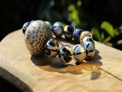 Unique big Palmwood ball brown/ grey, 29 mm with mixed rare Leather Beads. it can symbolize a connection to the natural world