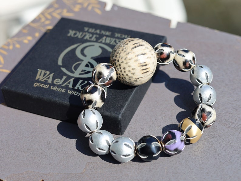 Unique big Palmwood ball brown/ grey, 29 mm with mixed rare Leather Beads. it can symbolize a connection to the natural world
