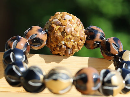 Chunk bead light brown stone covered with different light brown colored stones. Combined with Mixed colors Leather Beads.