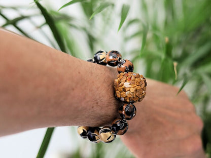 Chunk bead light brown stone covered with different light brown colored stones. Combined with Mixed colors Leather Beads.
