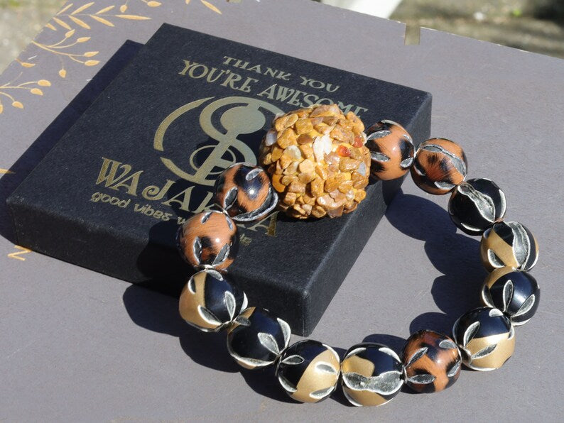Chunk bead light brown stone covered with different light brown colored stones. Combined with Mixed colors Leather Beads.