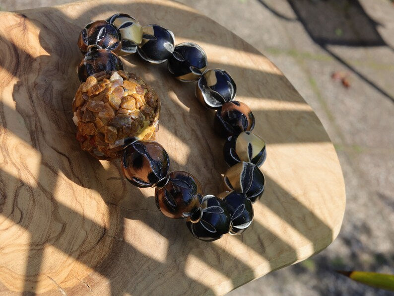 Chunk bead light brown stone covered with different light brown colored stones. Combined with Mixed colors Leather Beads.