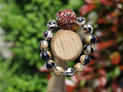 Chunk bead brown stone covered with different light brown colored stones. Combined with Mixed colors Leather Beads.
