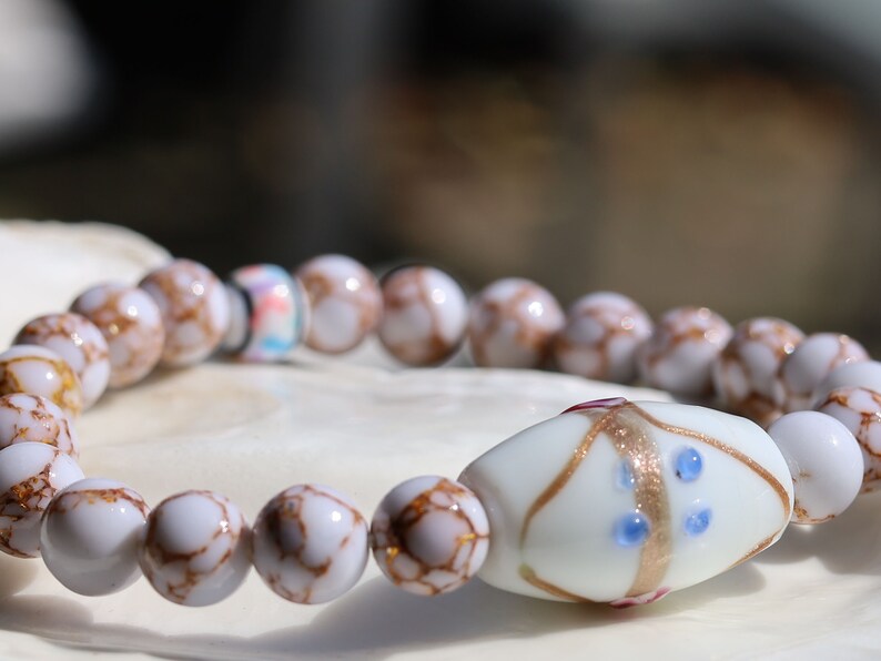 White Line Collection: White Turquoise Gold Color Wire Pine beads. Large white processed glass beads 28 mm. connection to a higher power