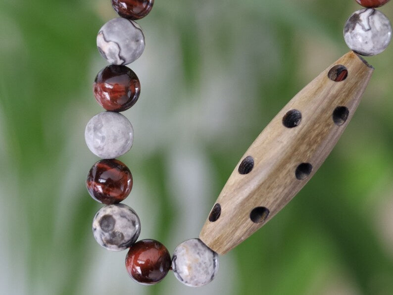 A beautiful large Horn bead with  Picasso Jasper  and red tiger eye beads. express your individuality and unique style.