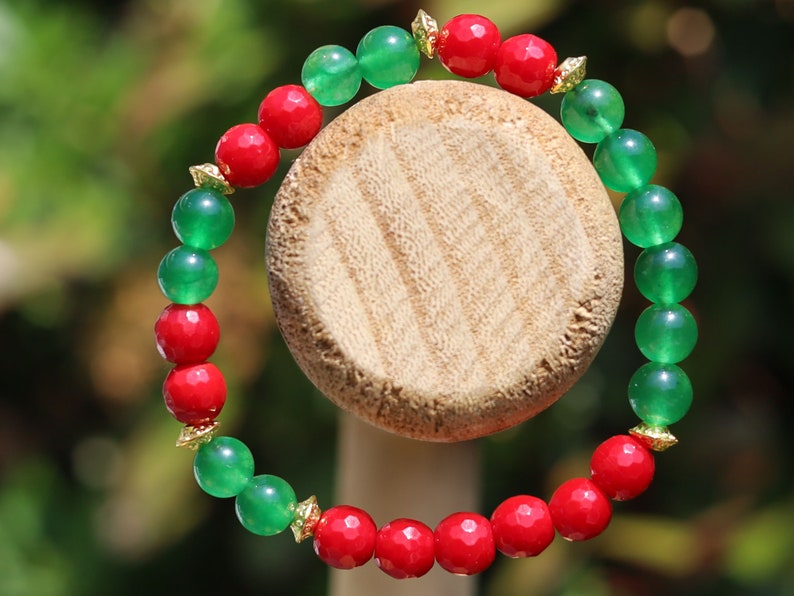 Natural Faceted Red Coral Stone bracelet with Green  Jade and Tibetan Style Alloy Spacer Discs.  Exquisite workmanship and great design!