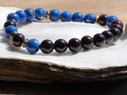 Blue Turquoise Shell Howlite beads and Red Garnet r stones.  Jewelry is a powerful way to express your individuality and unique style