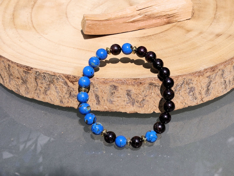 Blue Turquoise Shell Howlite beads and Red Garnet r stones.  Jewelry is a powerful way to express your individuality and unique style