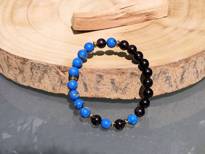 Blue Turquoise Shell Howlite beads and Red Garnet r stones.  Jewelry is a powerful way to express your individuality and unique style
