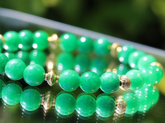 Natural Green Lace Jade with Tibetan Style Alloy Spacer Discs. is associated with balancing emotions, promoting harmony