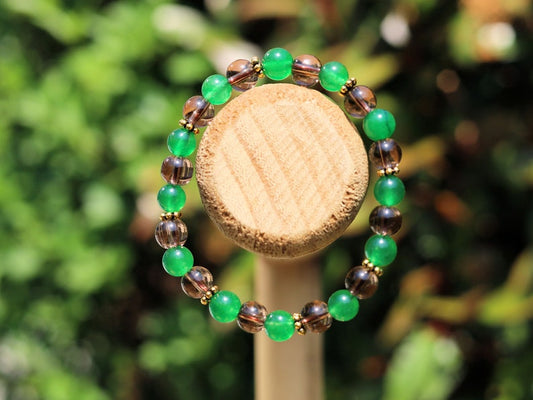 Smoky quartz bracelet with Green jade and Tibetan alloy material in Antique Gold. often associated with stability, protection