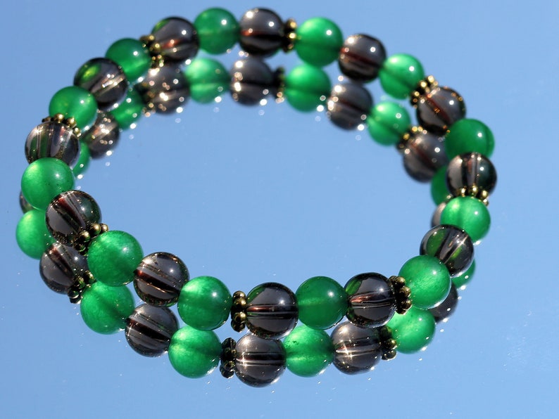 Smoky quartz bracelet with Green jade and Tibetan alloy material in Antique Gold. often associated with stability, protection