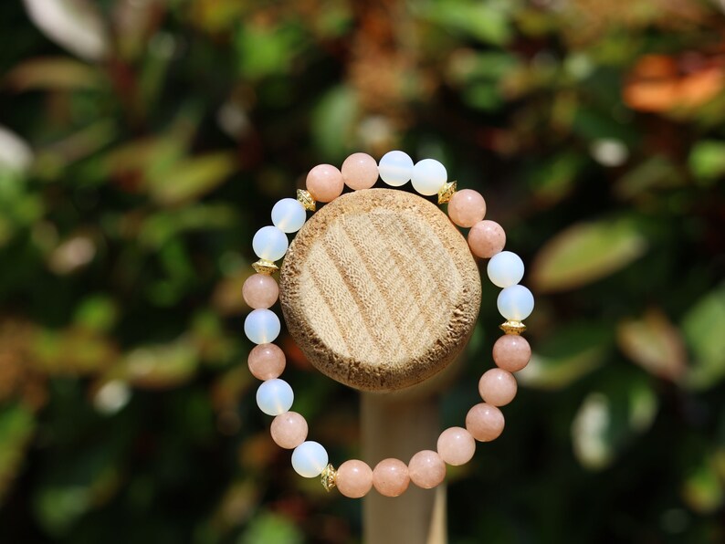 White opal bracelet with Sun stone beads. Sun stone is a unique and captivating gemstone known for its distinctive sparkling appearance.