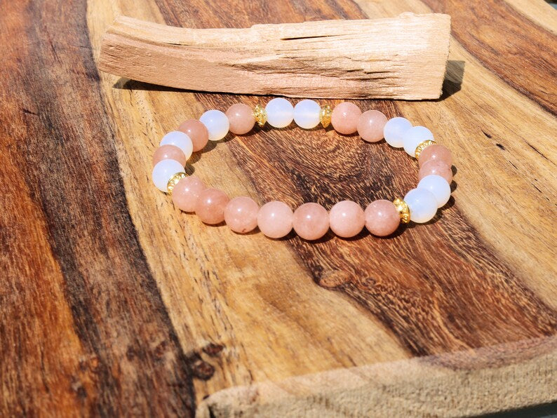 White opal bracelet with Sun stone beads. Sun stone is a unique and captivating gemstone known for its distinctive sparkling appearance.