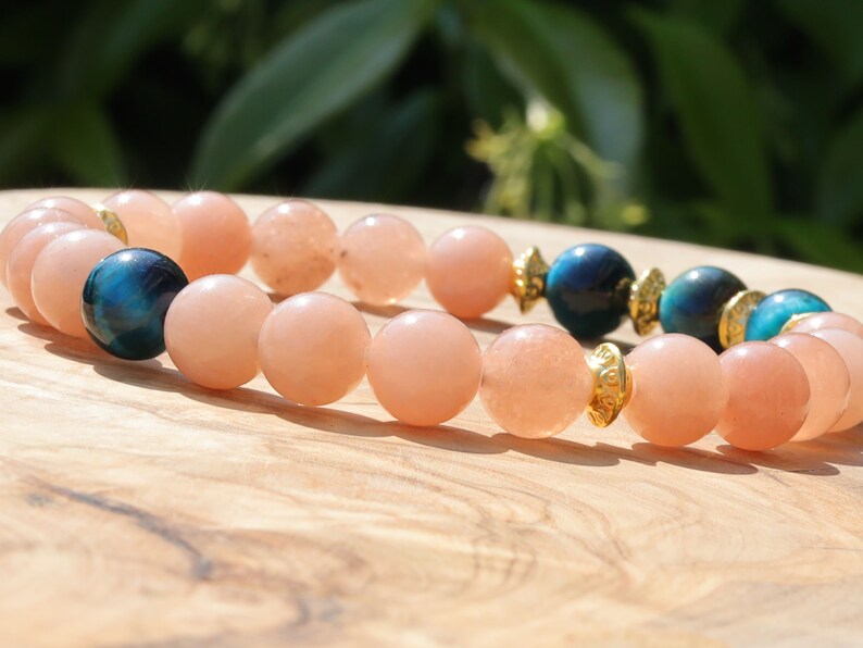 Multicolor Blue Tiger Eye Stone combined with captivating Sunstone. Blue Tiger Eye, also known as Hawk's Eye. improve communication