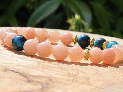 Multicolor Blue Tiger Eye Stone combined with captivating Sunstone. Blue Tiger Eye, also known as Hawk's Eye. improve communication