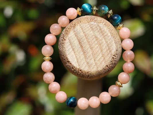 Multicolor Blue Tiger Eye Stone combined with captivating Sunstone. Blue Tiger Eye, also known as Hawk's Eye. improve communication