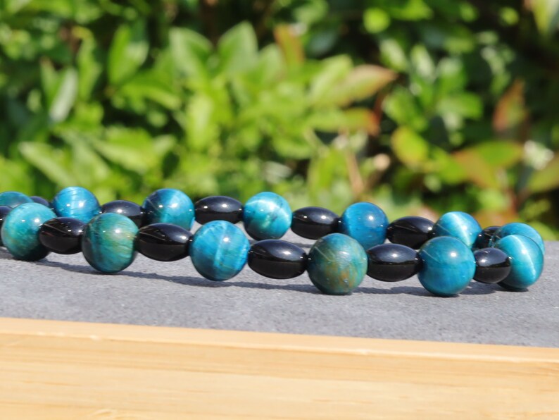 Natural Black Agate Barrel Beads with  Blue Tiger Eye, also known as Hawk's Eye beads. making it a beneficial stone for students and artists