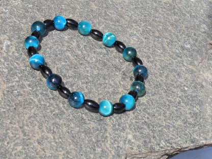 Natural Black Agate Barrel Beads with  Blue Tiger Eye, also known as Hawk's Eye beads. making it a beneficial stone for students and artists