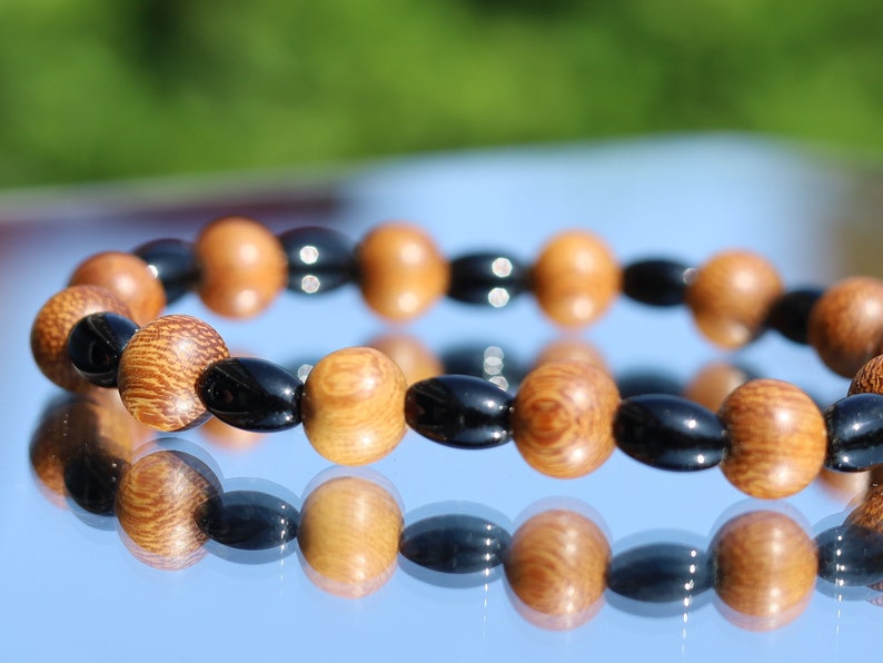 Unique Madre de Cacao Wood bracelet combined with Natural Black Agate Barrel Beads. Most favored botanical medicines in South America