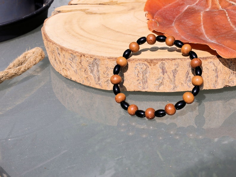Unique Madre de Cacao Wood bracelet combined with Natural Black Agate Barrel Beads. Most favored botanical medicines in South America