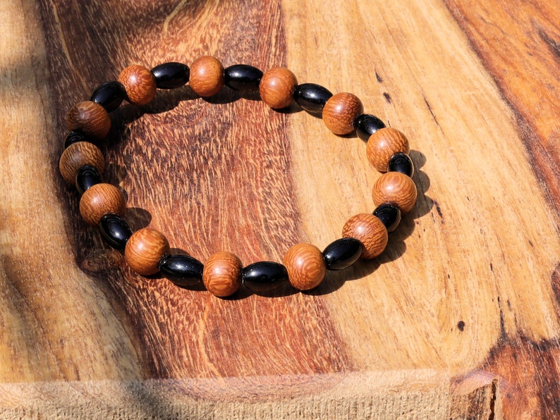 Unique Madre de Cacao Wood bracelet combined with Natural Black Agate Barrel Beads. Most favored botanical medicines in South America