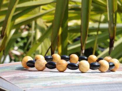 Unique Palo Santo Wood bracelet combined with Natural Black Agate Barrel Beads. Perfect handmade gifts and on-trend unique jewelry.