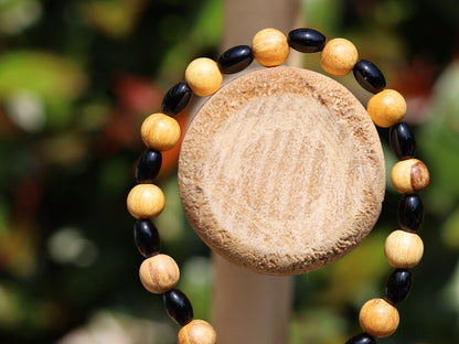 Unique Palo Santo Wood bracelet combined with Natural Black Agate Barrel Beads. Perfect handmade gifts and on-trend unique jewelry.