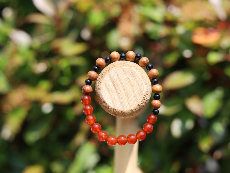 Unique Madre de Cacao Wood bracelet combined with Carnelian red beads. And Black Round Natural Wood Beads. unique style