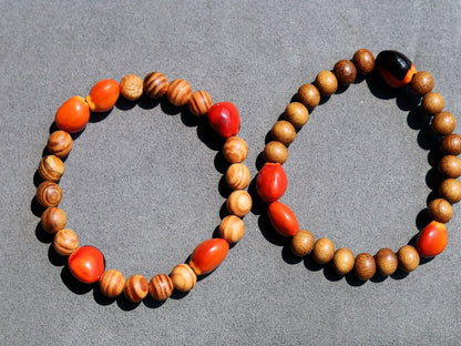 Wooden Bracelet set.  Madre de Cacao Wood beads with 5x Huayruro grande.  Raja Kayu matte beads with 5x Huayruro grande