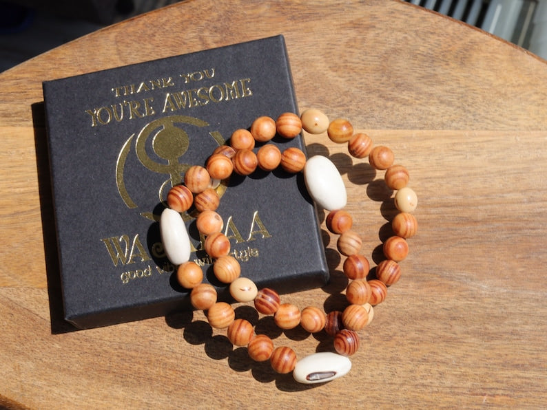 Wooden Bracelet Set. Raja Kayu matte beaded bracelets with Acai broken white seeds and Huayruro white 20mm seeds beads.