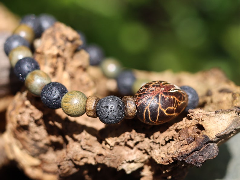 Kili seed bracelet with Lava and Olive Green Round Natural Wood Beads. Beautiful Disc coconut beads. Diffuser bracelets