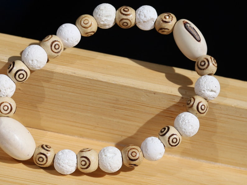 Huayruro white beads bracelet with white Lava and Wooden beads with spiral..offer a unique and natural element to jewelry