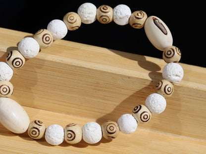 Huayruro white beads bracelet with white Lava and Wooden beads with spiral..offer a unique and natural element to jewelry