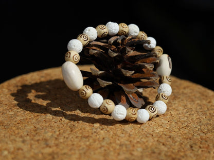Huayruro white beads bracelet with white Lava and Wooden beads with spiral..offer a unique and natural element to jewelry