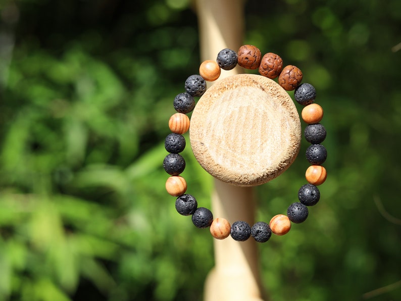 Polished Rudraksha bracelet with Raja Kayu and Lav beads.  the Supreme King in the forest among all different pieces of trees