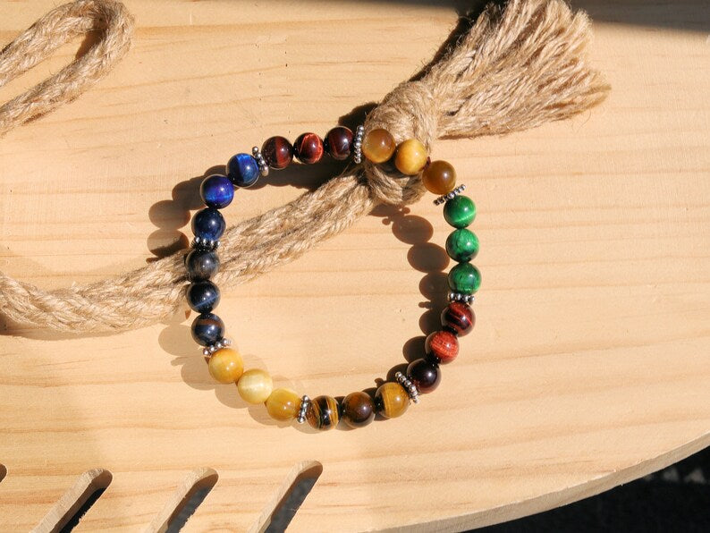 Multi colored tiger eye bead bracelet combined with FLAT SQUARE tibetan Style Alloy Pearl Spacer Discs. Outstanding and Astonishing.