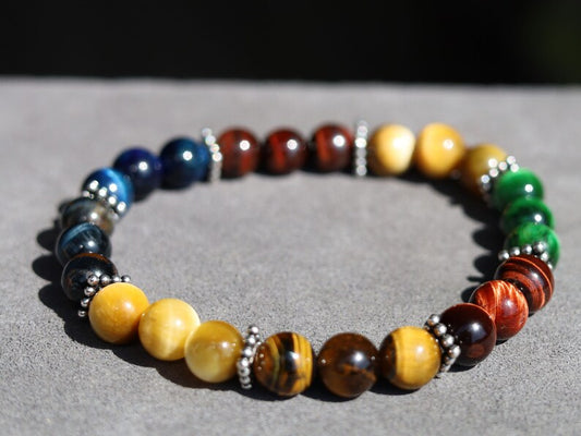 Multi colored tiger eye bead bracelet combined with FLAT SQUARE tibetan Style Alloy Pearl Spacer Discs. Outstanding and Astonishing.