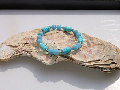 Stabilized Turquoise Gemstone Heishi Beads with Aquamarine Agate Stone Beads.  It is a design that stands out and captures attention