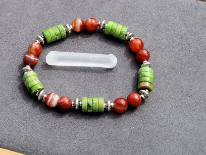 Green Sea Sediment Jasper Gemstone Heishi Spacer bracelet with Banded orange beads. different from what is commonly seen or expected