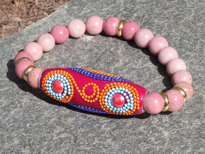 Rice Handmade Indonesia bracelet with Rhodochrosite beads and Tibetan Style Alloy Spacer Discs. The art of expressing your taste and style