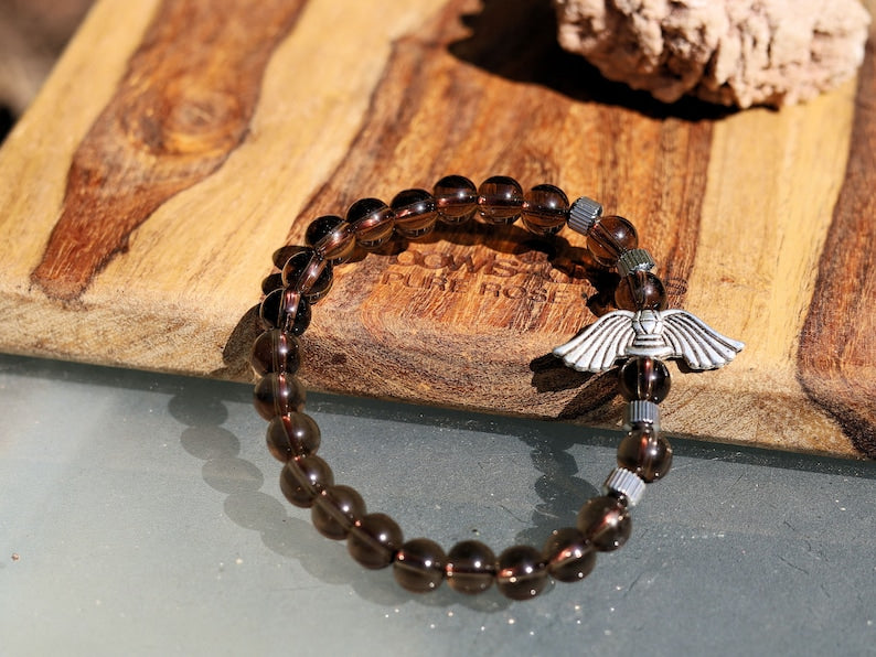 Smoky Quartz Stone bracelet with Angel Wings Beads and Stainless Steel Beads Gold Color.  can serve as a reminder of divine presence