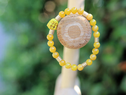 Yellow Chalcedony Jade combined and and Stainless Steel Beads Gold Color.  symbol of happiness and success, protecting those who carry it
