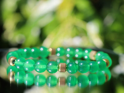 Green jade and  Stainless Steel Beads Gold Color spacer beads. Green Jade is particularly associated with the heart chakra,representing love